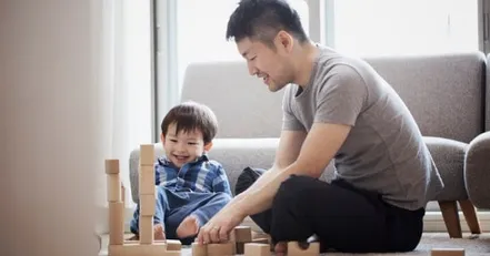 Father building blocks with his toddler