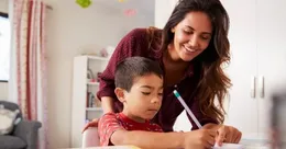 Mother helping her son with homework
