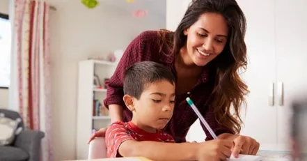 Mother helping her son with homework