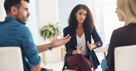 People arguing in front of a lawyer