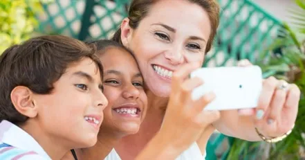 Mother and children taking selfie