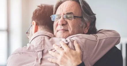 Father and son hugging
