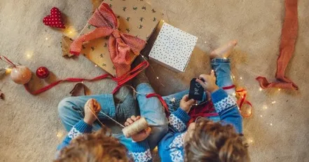 Children wrapping presents