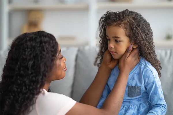 Mother consoling sad child