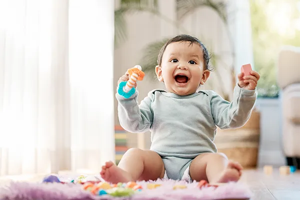 Baby smiling at camera