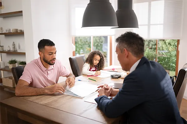 Father working on custody agreement with lawyer