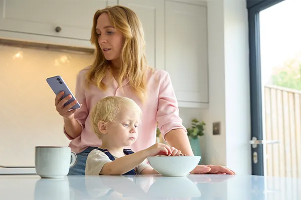 Mother looking at phone