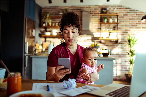 Mother texting co-parent