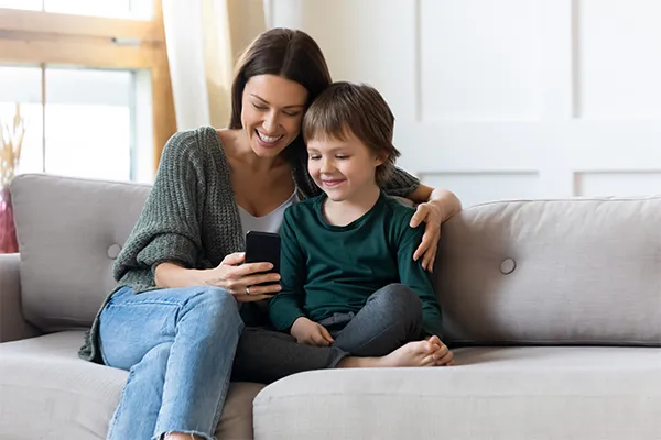 Mother and son on couch