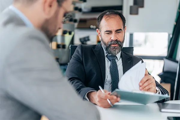 Lawyer reviewing evidence with client