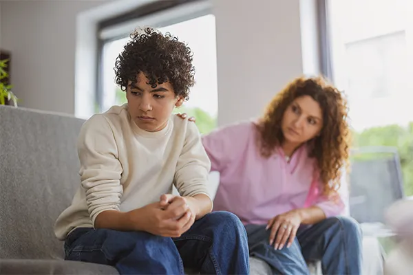 Mother trying to connect with her distant teenage son