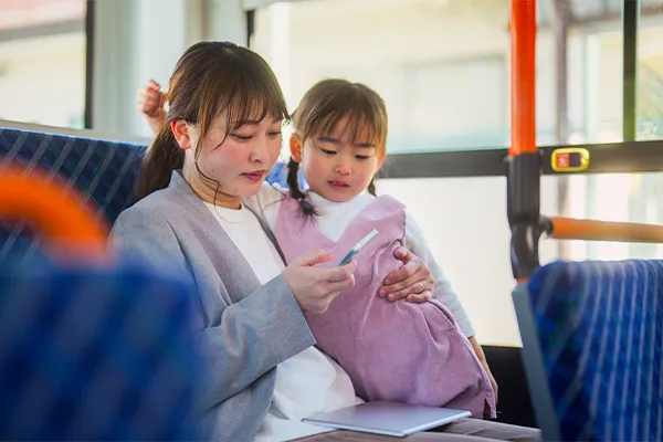 Mother texting co-parent
