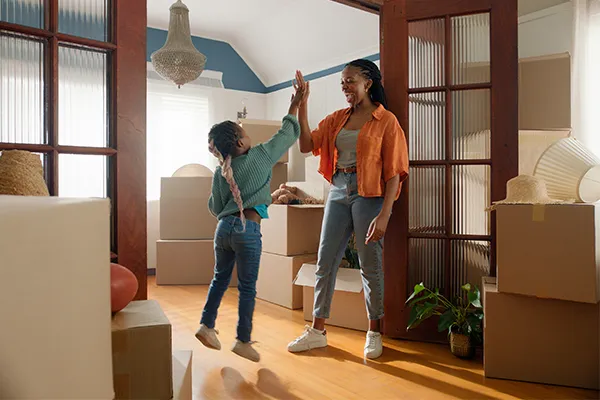 Mother unpacking with daughter