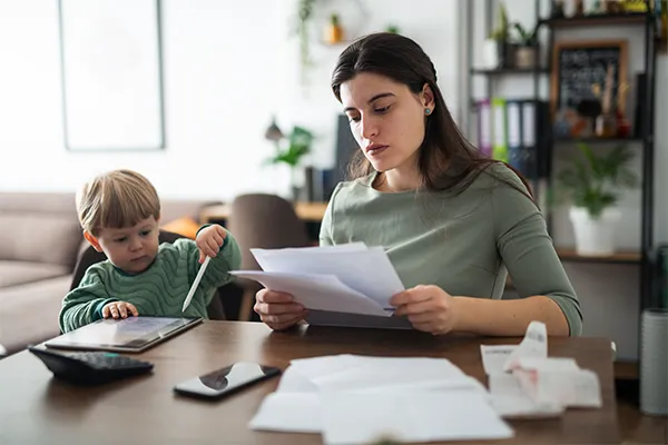 Mother reviewing legal forms