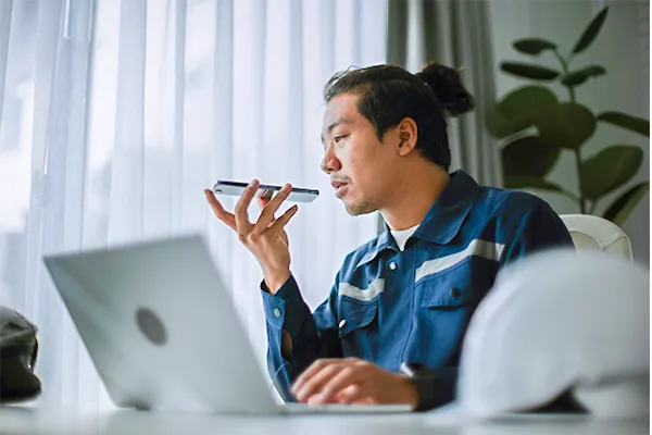 Man talking to AI on his phone