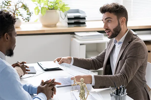 Lawyer reviewing prenup with clients