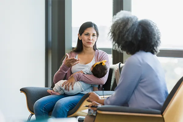 New mother talking to a therapist