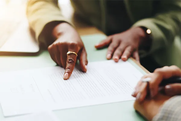 Lawyer showing client documents