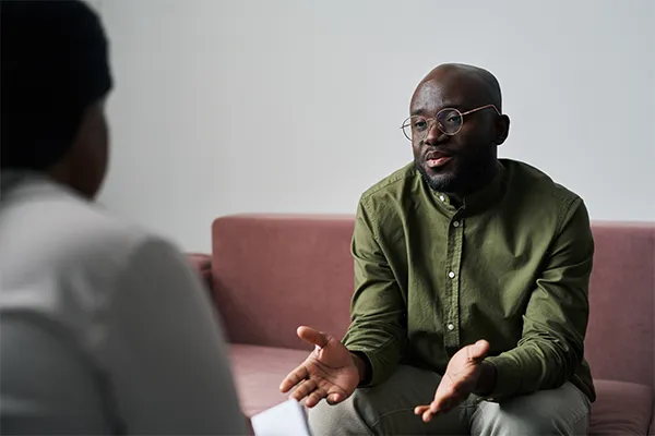 Man speaking to a therapist