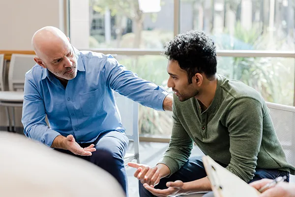 Man talking to a therapist