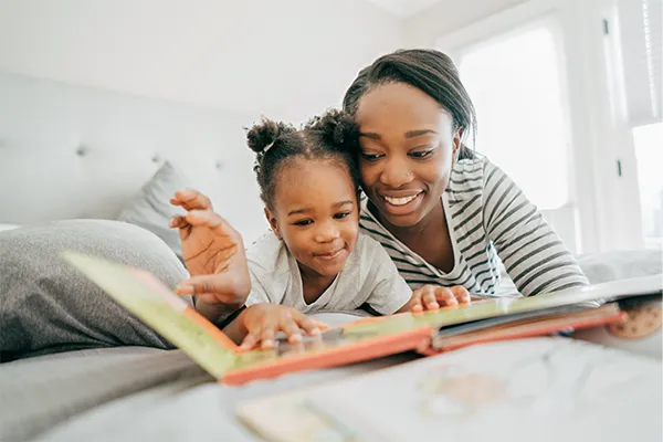 Mother reading with her daughter