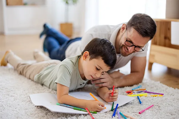Father coloring with son