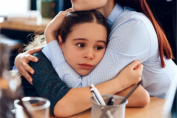 Daughter holding onto mother