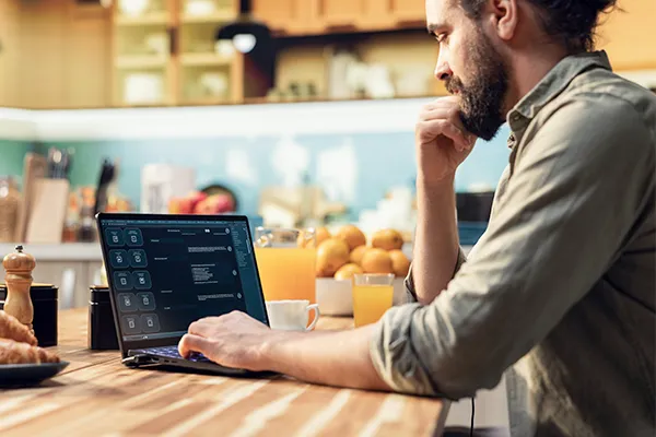 Man reading AI chat on his computer