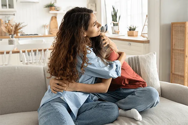 Mother holding her daughter