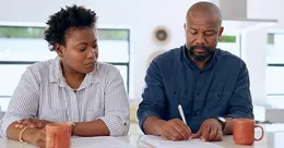 Co-parents signing legal papers