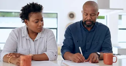 Co-parents signing legal papers