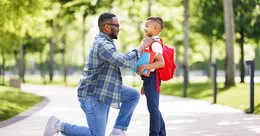 Father taking son to school