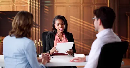 Co-parents talking to a parenting coordinator