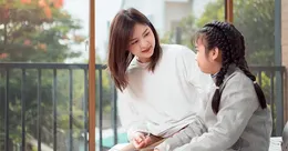 Mother talking to daughter