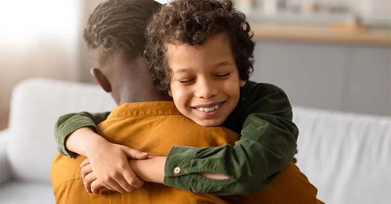 Son hugging father