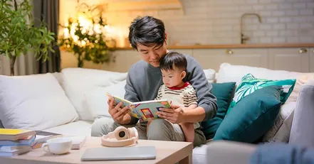 Father reading to baby