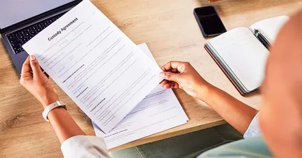 Mother reviewing custody agreement