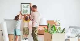 Father unpacking with children