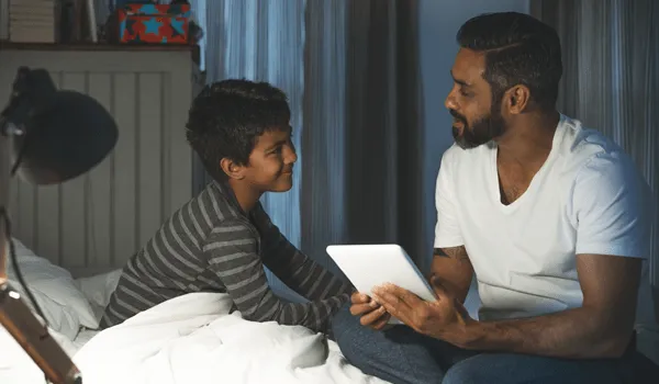 Father and son with tablet