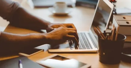 Person typing on computer