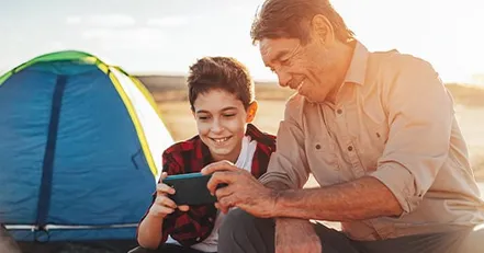 Father and son looking at phone