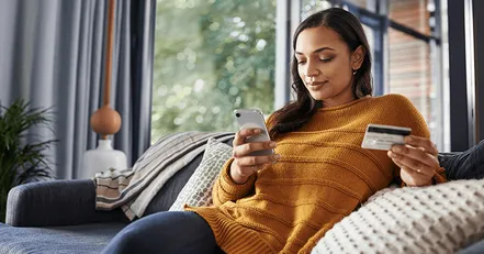 Woman checking credit card expenses
