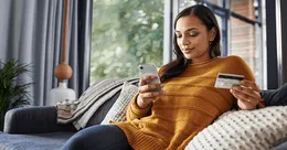 Woman checking credit card expenses