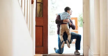 Child hugging his father