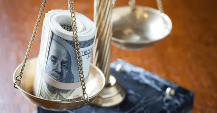 Money on scales