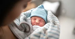 Parent holding newborn