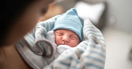 Parent holding newborn