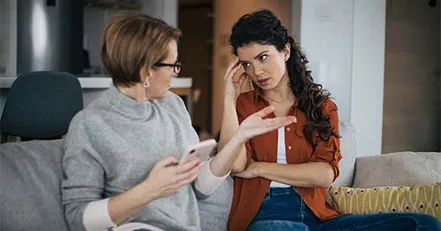 Mother checking daughter’s phone