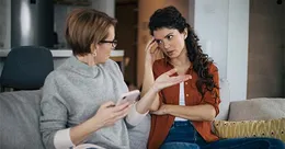 Mother checking daughter’s phone