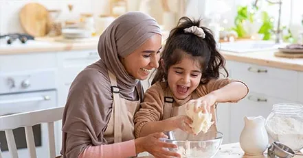 Mother and daughter baking